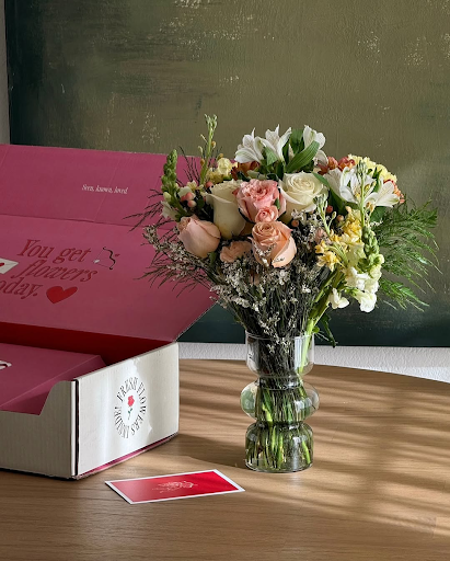 Bouquet of white and pink roses, alstroemeria, and mixed flowers in a textured clear glass vase from Fresh Sends.-317422862703