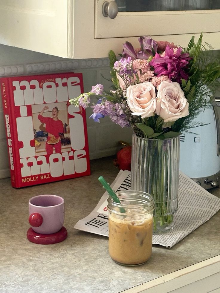 Fresh Sends pink flower bouquet in a vase placed next to a coffee cup on a table.-320268108143