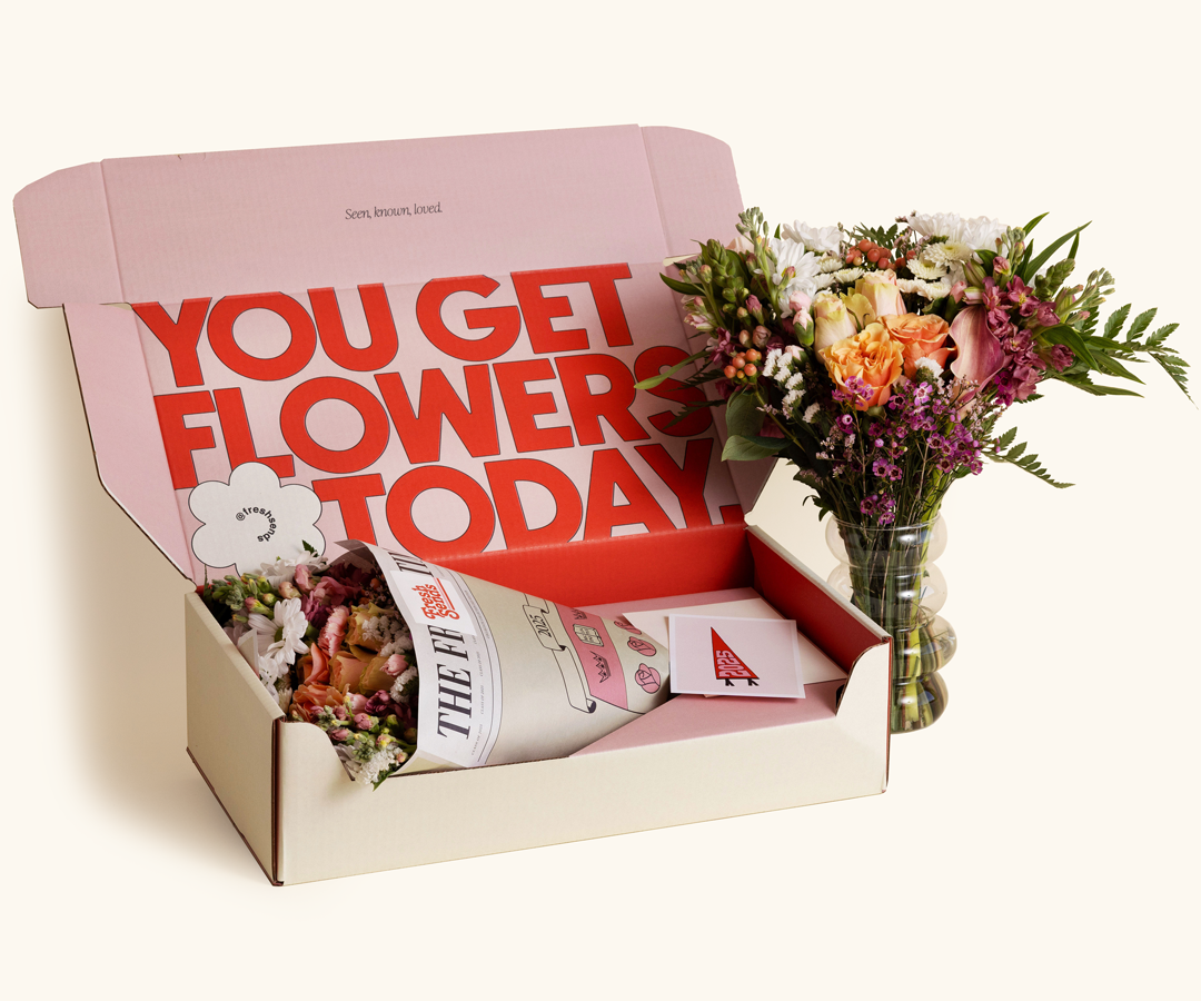 Fresh Sends' Graduate Send with celebratory flowers wrapped in collegiate-themed paper and a custom graduation card.