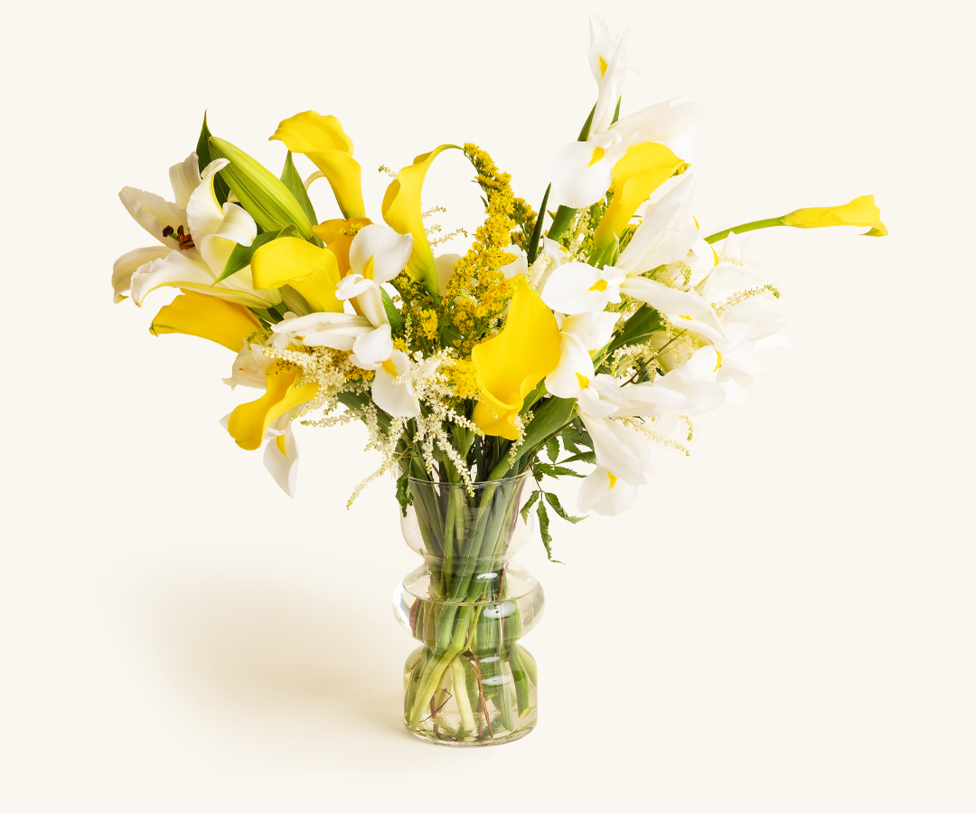 Mother's Day Signature Send flower arrangement in a glass vase featuring a seasonal mix of fresh blooms and greenery.